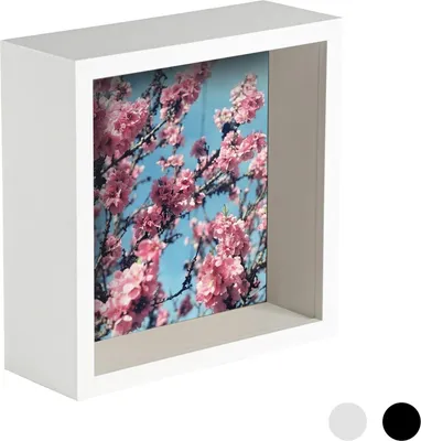 A white box photo frame displaying a picture of pink cherry blossoms against a blue sky.