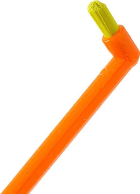 A close-up shot of an orange interdental brush with yellow bristles against a white background.