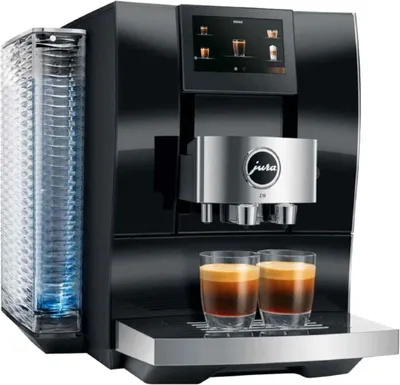 A modern black automatic coffee machine with two glasses of espresso and a cup dispenser.