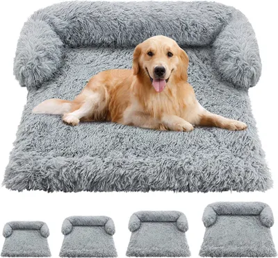A golden retriever dog lying on a plush gray dog bed.