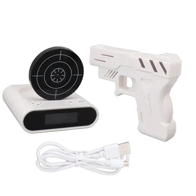 A white alarm clock with a target and a white toy gun are displayed on a white background.