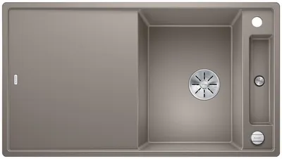 A top-down view of a kitchen sink with a draining board.