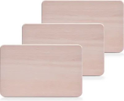 Three wooden cutting boards are stacked diagonally on a white background.