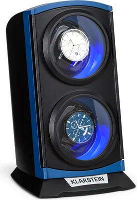 A product shot of a double watch winder with two watches inside, illuminated by blue LED lights.