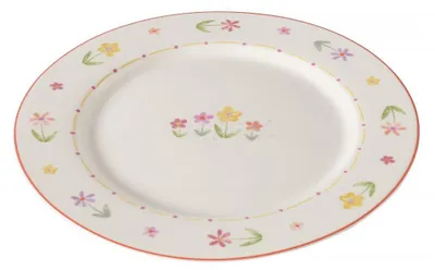 A white plate with a floral pattern around the rim and in the center.