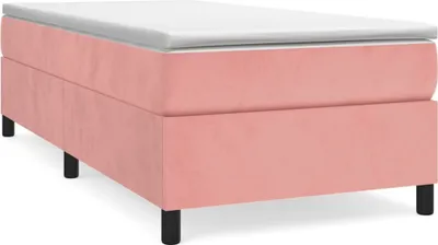 A pink boxspring bed frame with a white mattress on top, shown from a side-angle on a white background.