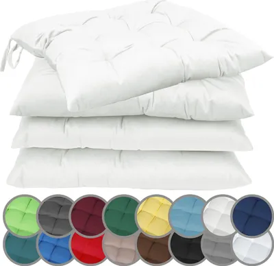 A stack of white seat cushions with a row of colored swatches below.