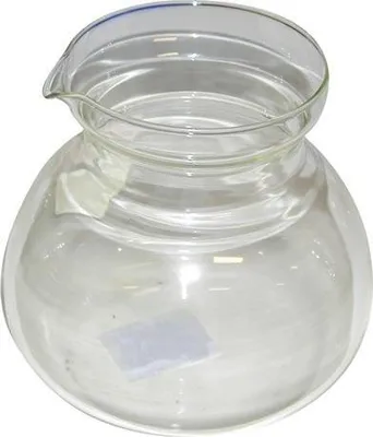 A clear glass teapot without a lid, shown from a slightly elevated angle against a white background.