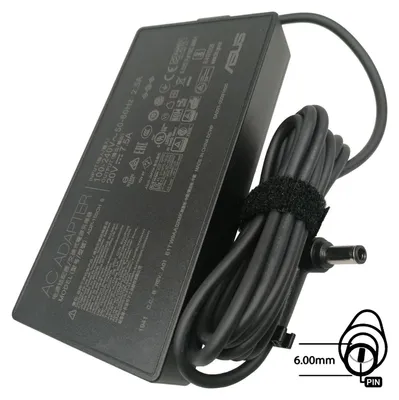 A black Asus AC adapter with its power cord coiled and secured with a velcro strap. A diagram indicating the connector size is shown on the right.