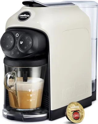 A Lavazza coffee machine with a cup of coffee and a coffee capsule.