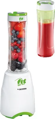 A personal blender with a bottle of berries and a bottle of smoothie.