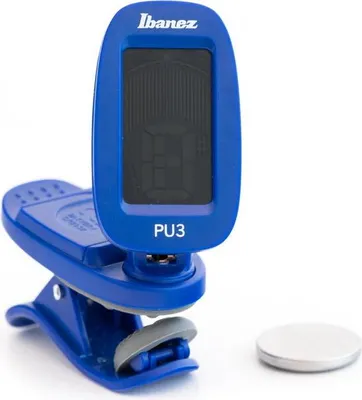 A blue Ibanez PU3-BK chromatic clip-on tuner is shown on a white background, with a silver coin-shaped battery next to it.