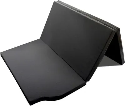 A folded black mattress is shown against a white background.