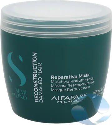 A product shot of a hair mask in a teal tub with a white lid.