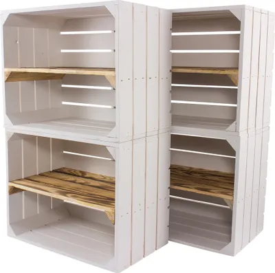 Four white wooden crates stacked in an L-shape, with wooden shelves inside some of the crates.