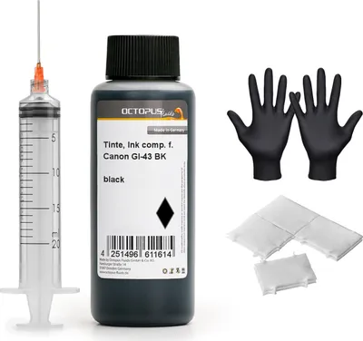 A collection of items for refilling printer ink, including a syringe, ink bottle, gloves, and cleaning pads.