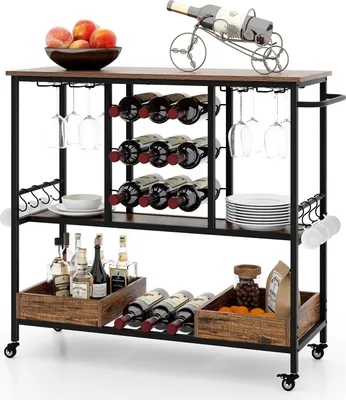 A 3-tier industrial-style bar cart filled with wine bottles, glasses, plates, and fruit, set against a white background.