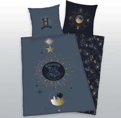A Harry Potter themed duvet cover and pillowcase set laid out on a light gray surface.