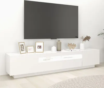 A white TV stand with a large black TV mounted above it.