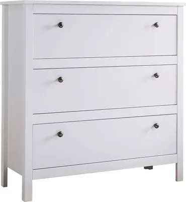 A white chest of drawers with three drawers, each with a dark knob.
