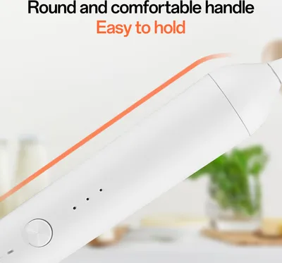 Close-up of a white handheld electric frother with text overlays.