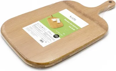 A wooden cutting board is shown on a white background, wrapped in clear plastic packaging. A label with product information and a small image is attached to the packaging.