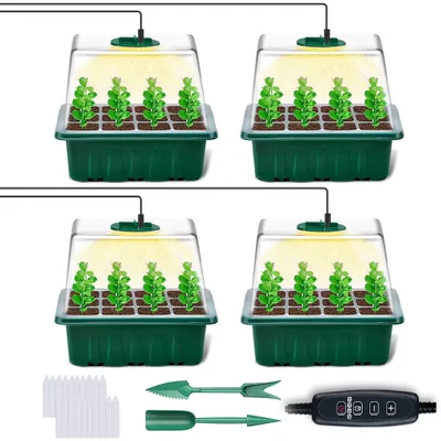 Four identical seed starter trays with clear lids and grow lights, along with gardening tools and plant markers, are displayed against a white background.