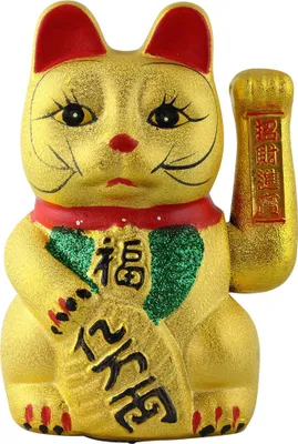 A golden Maneki-neko (lucky cat) figurine.