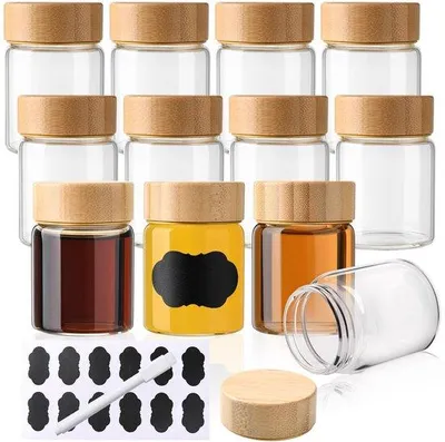 Productafbeelding van Shotflessen 12 stuks - 60 ml Borosilicaatglas - Bamboedeksel - Vaatwasmachinebestendig - Herbruikbaar - Inclusief etiketten en pen - Mini Flessen
