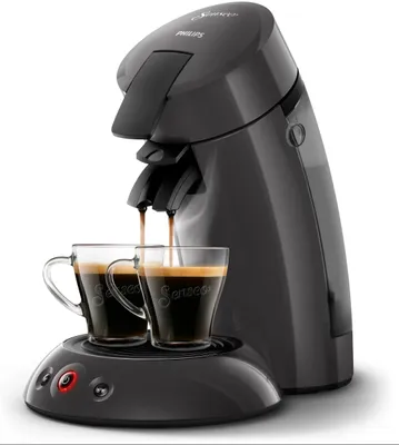 A Philips Senseo coffee machine brewing coffee into two glass cups.