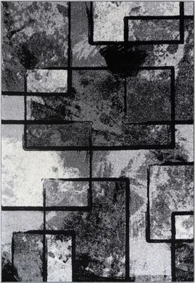 A close-up, top-down view of a rug with an abstract geometric pattern in shades of gray and black.