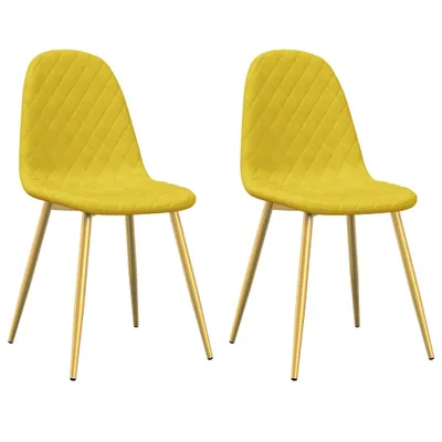 Two yellow velvet dining chairs with gold legs against a white background.