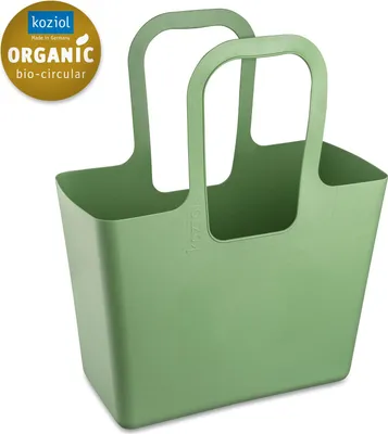 A green Koziol bag on a white background.