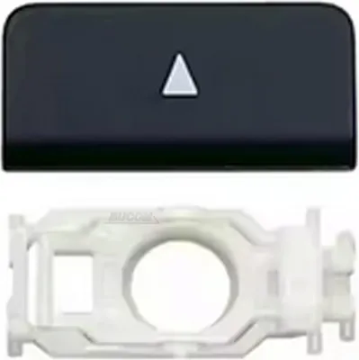 A black keycap with a white triangle symbol and a white plastic mounting bracket are shown against a white background.