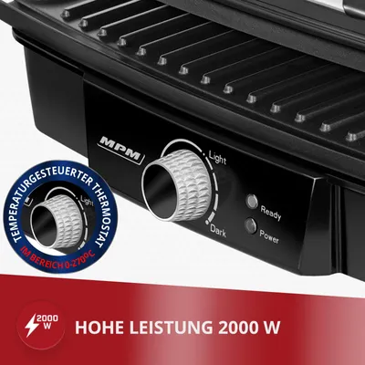 Close-up of a black electric grill's control panel and top grill plate.