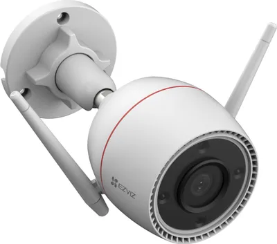 A white outdoor security camera with two antennas, mounted on a gray bracket.