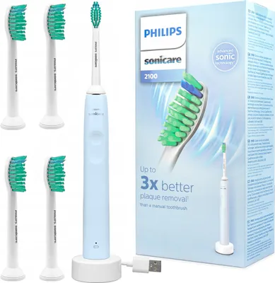 A Philips Sonicare electric toothbrush with multiple brush heads and its packaging are displayed against a white background.