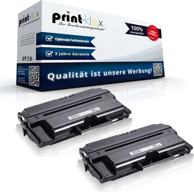 Two black toner cartridges are displayed in front of a product box with marketing text.