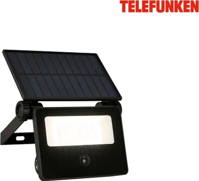 A black solar-powered spotlight with an attached solar panel, set against a white background. The brand name "TELEFUNKEN" is visible in red text in the upper right corner.
