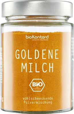 A glass jar filled with golden powder, labeled with product information.