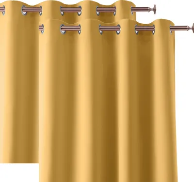 Two yellow curtains with grommets are shown against a white background.