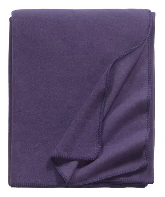 A folded purple fleece blanket on a white background.