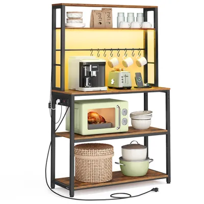 A multi-tiered kitchen shelf unit with various kitchen appliances and cookware displayed on its shelves.