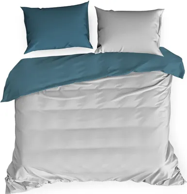 A duvet cover and pillowcases laid out on a white surface.