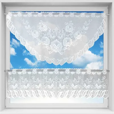 A window with white lace curtains hanging.