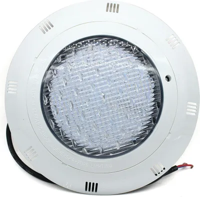 A white, round LED pool light with a clear lens showing many small LED lights.