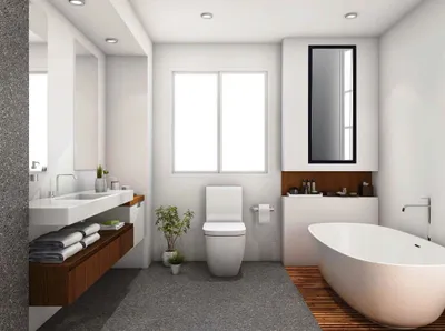 A modern bathroom with a bathtub, toilet, and vanity.