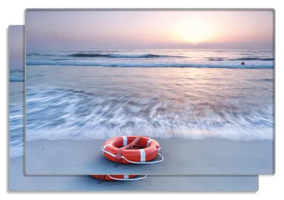 Produktbild von Wallario Frühstücksbrettchen 2er Set aus Glas, je 20 x 30 cm, mit rutschfesten Füßen, Motiv Rettungsring am Strand bei Sonnenuntergang