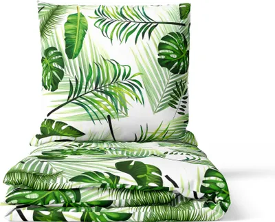 A folded duvet and pillow with a tropical leaf pattern against a white background.
