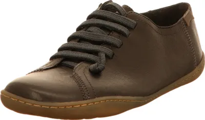 A single brown leather shoe with dark laces is shown from a side-angle on a white background.